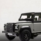 Land Rover Defender électrique Bymoss — gris 3/4 avant